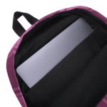 A Backpack Celtic Fucia Pink and Burgundy and Black Highland Plaid, can hold up to a 15" Laptop, or Tablet, many pockets for more, Padded Shoulder Straps with a laptop inside.