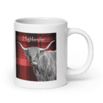 White mug with a highland cow design.