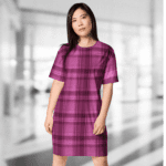 Woman wearing a pink plaid dress.