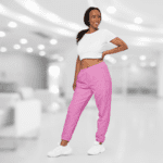 Woman wearing pink sweatpants and white shirt.