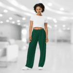 Woman wearing white shirt and green pants.