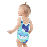 Baby girl in a blue stingray swimsuit.