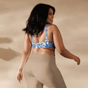 Woman in blue floral sports bra and leggings.