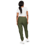 Woman in green sweatpants and white shirt.