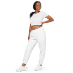 Woman in white crop top and sweatpants.