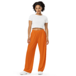 Woman in white shirt and orange pants.