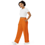 Woman in white shirt and orange pants.