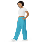 Woman in a white shirt and blue pants.