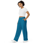 Woman in white shirt and blue pants.