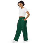 Woman in white top and green pants.