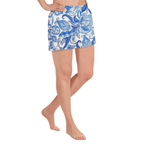 Woman wearing blue and white floral shorts.