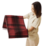 Woman holding red and black plaid fabric.