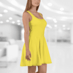 Woman in a yellow sleeveless dress.