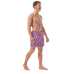 Man wearing floral print swim trunks.