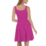 Woman in a pink sleeveless skater dress.