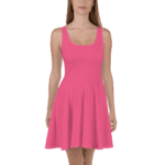 Woman wearing a pink sleeveless skater dress.