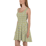 Woman in a yellow floral sleeveless dress.