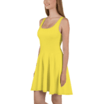 Woman wearing a yellow sleeveless dress.