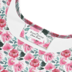 White fabric with pink floral pattern.