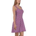 Woman wearing a pink floral sundress.