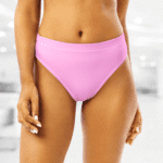 Woman wearing pink bikini bottom.