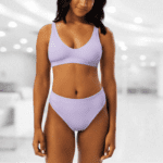 Woman wearing a lavender bra and underwear.