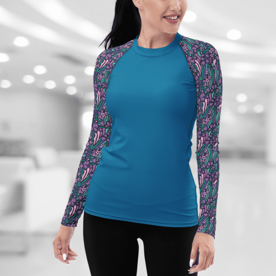 Woman wearing a blue and floral shirt.