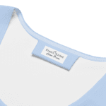 Light blue fabric with a name tag.