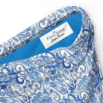 Blue and white paisley fabric with a label.