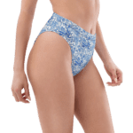 Woman wearing blue and white patterned bikini bottoms.