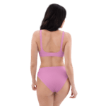 Woman in pink bikini from behind.