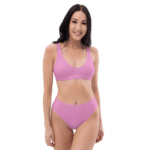 Woman in pink bikini top and bottoms.