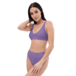 Woman in purple bikini top and bottoms.