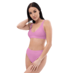 Woman in pink bikini top and bottom.