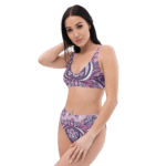 Woman in a pink and purple paisley bikini.