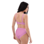 Woman in pink bikini bottoms and bra.