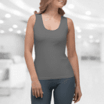 Woman wearing a gray tank top.