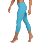 Woman wearing blue capri leggings.