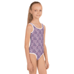 Girl wearing a paisley swimsuit.