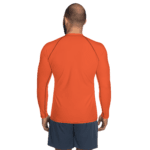 Man in orange long-sleeve shirt and shorts.