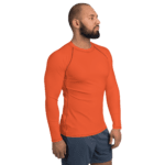 Man wearing a long-sleeved orange shirt.