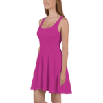 Woman wearing a pink sleeveless dress.