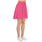 Woman in a pink skater skirt and white shoes.