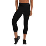 Woman wearing black high waisted leggings.