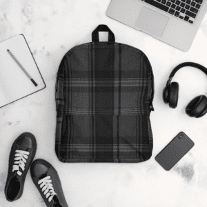 Black plaid backpack with laptop and headphones.