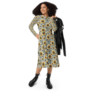 Woman in sunflower print dress and boots.