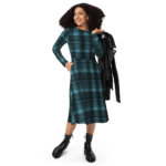 Woman wearing a blue plaid dress and boots.