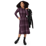 Woman in a plaid dress and boots.