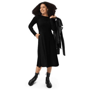 Woman in black dress and boots, holding jacket.