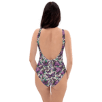 Woman wearing floral and butterfly swimsuit